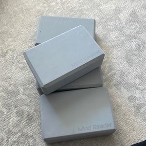 4 gray yoga blocks